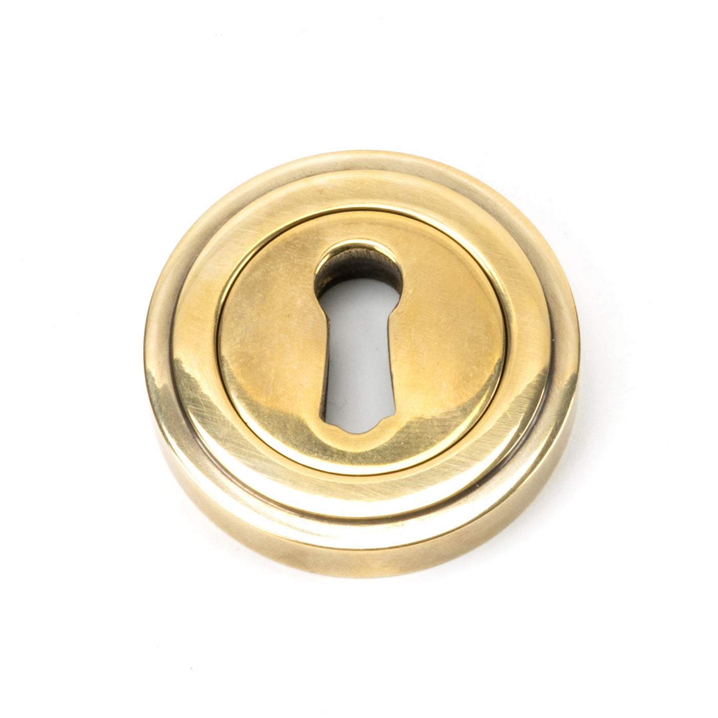 From The Anvil 45684 - Aged Brass Round Escutcheon (Art Deco) #finish_aged-brass