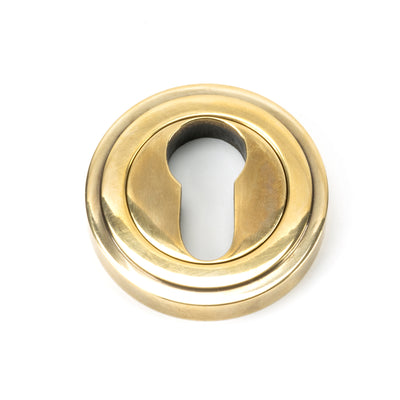 From The Anvil 45708 - Aged Brass Round Euro Escutcheon (Art Deco) #finish_aged-brass