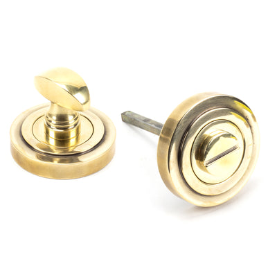 From The Anvil 45732 - Aged Brass Round Thumbturn Set (Art Deco)  #finish_aged-brass